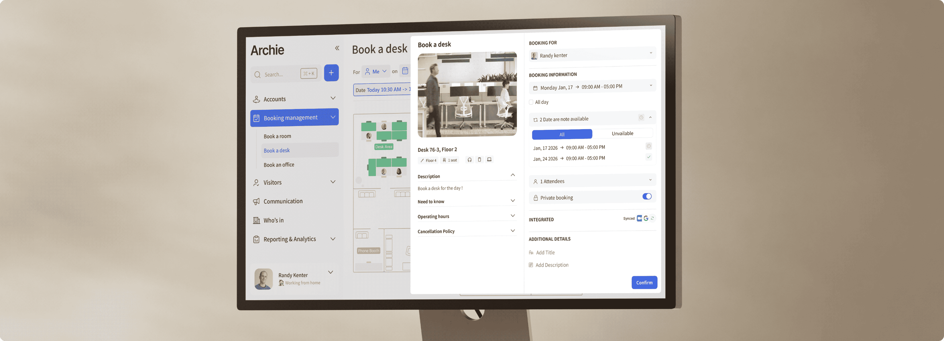 Monitor displaying a desk booking management system with booking details and floor map.