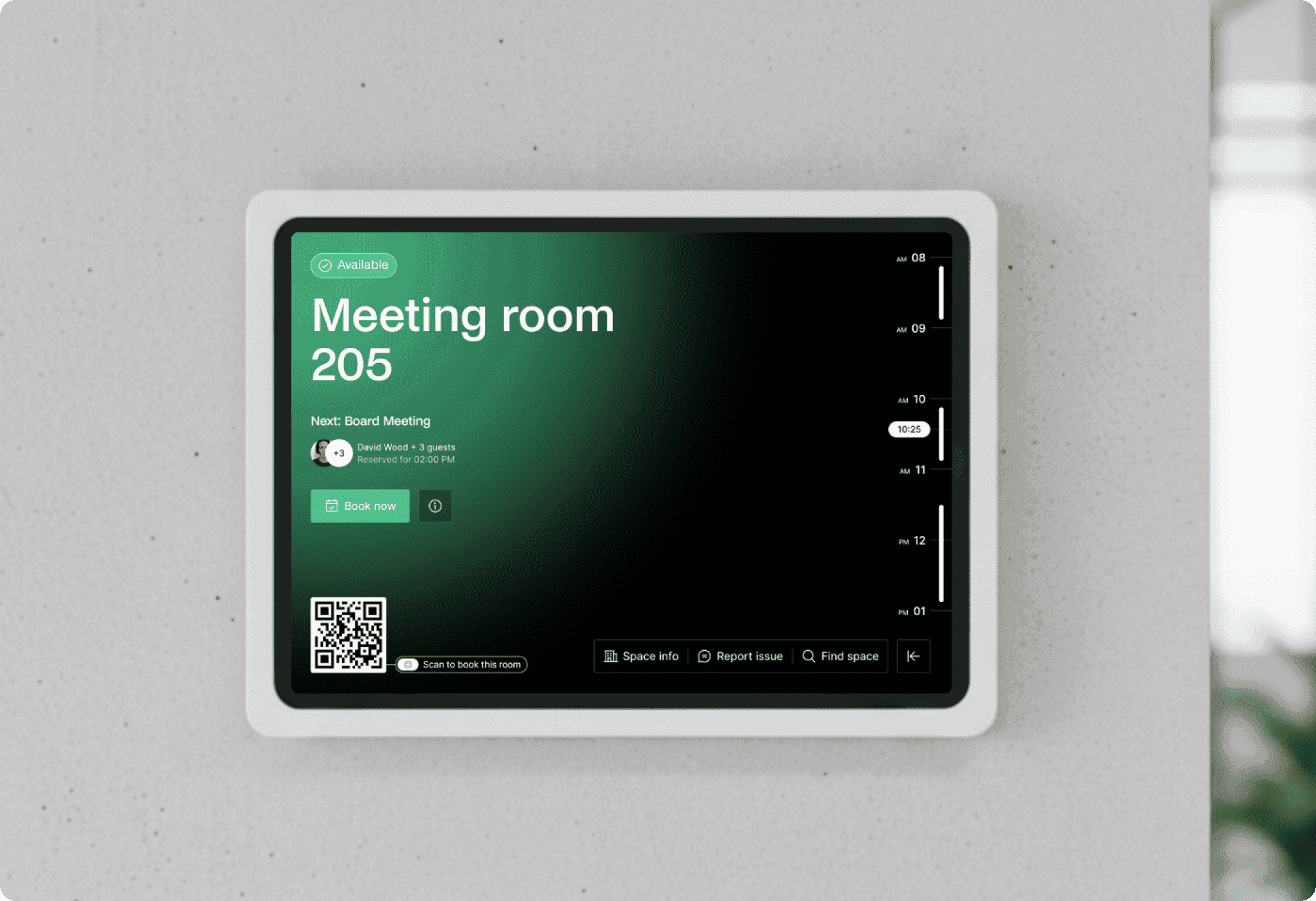Wall-mounted digital screen showing meeting room information and scheduling interface