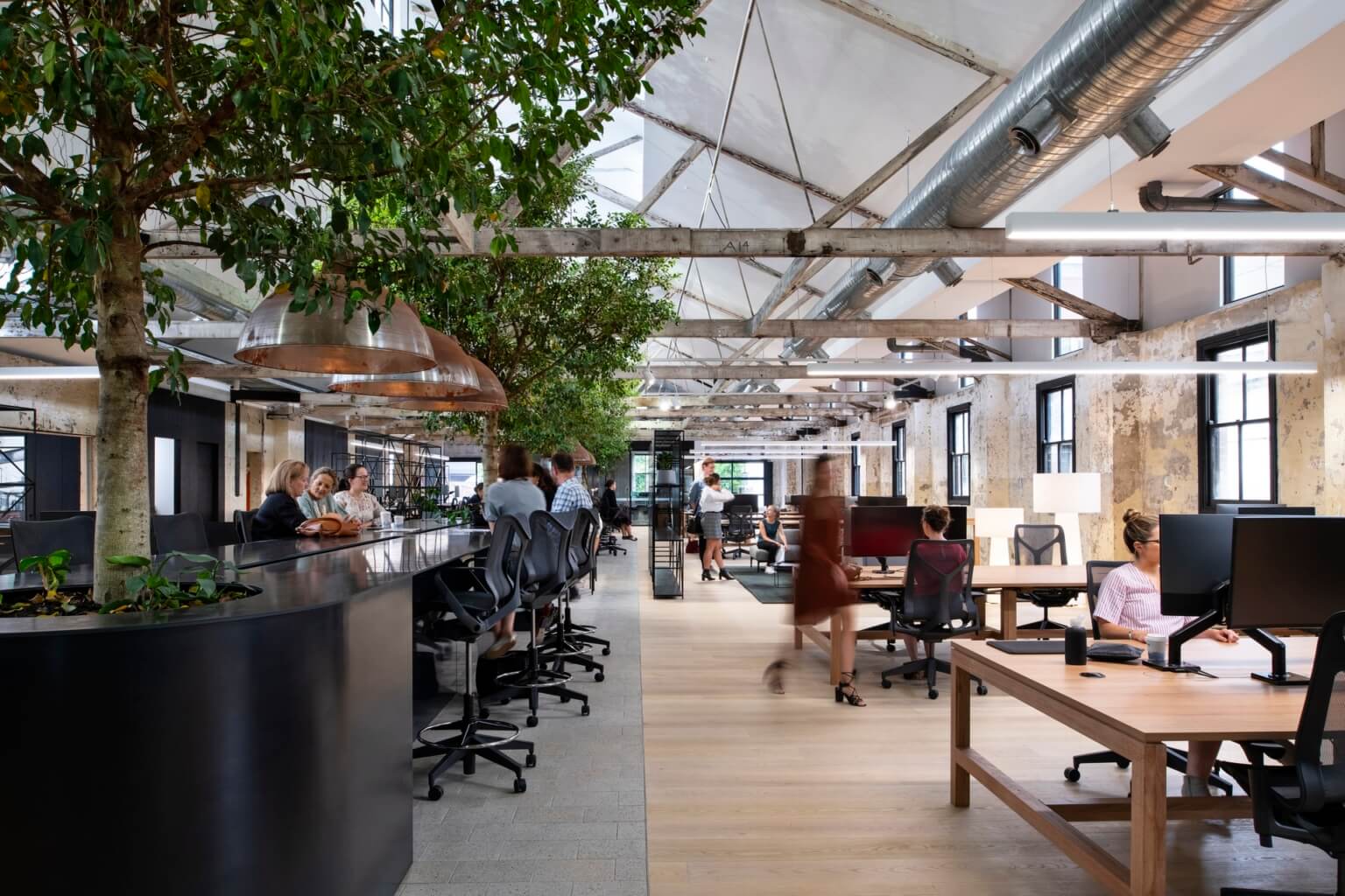 People sharing a desk area in a coworking space
