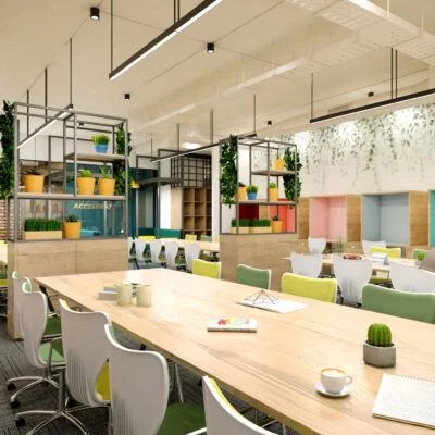 A colorful coworking space with long wooden desks, white chairs, potted plants, and cozy wall nooks for focused work.