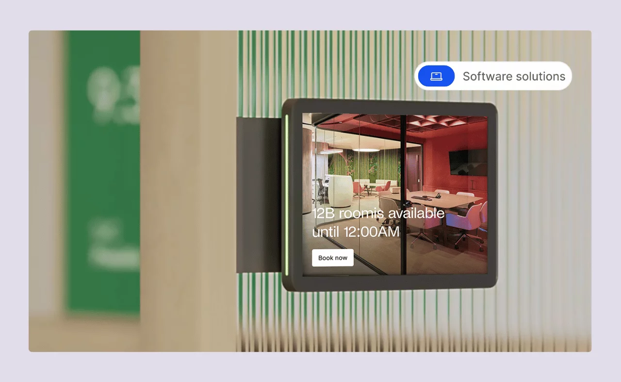 A digital room display panel showing a meeting room's availability and a “Book now” button.