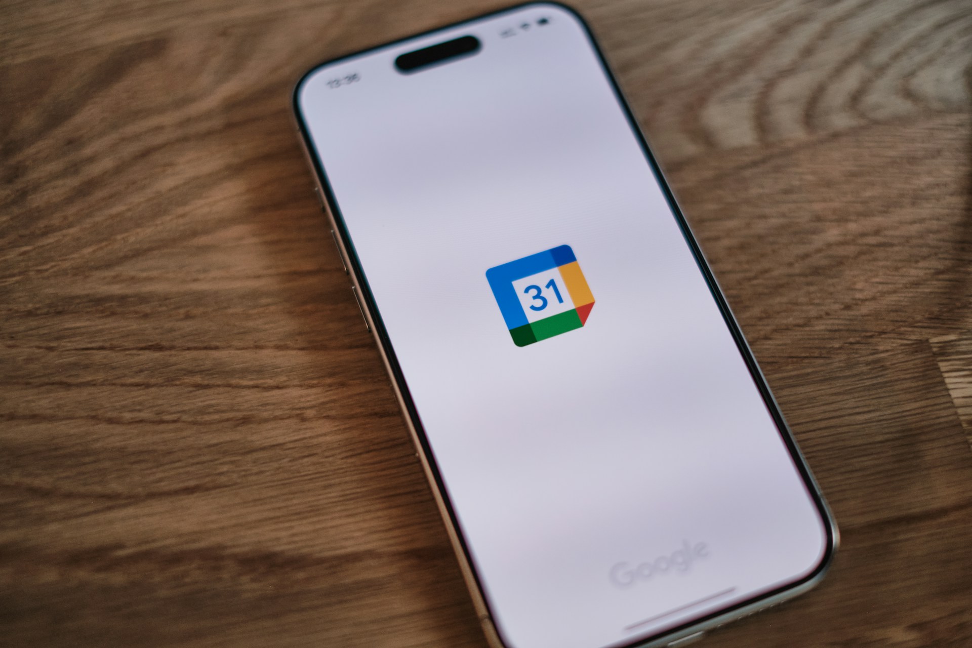 A mobile phone with a Google Calendar app.