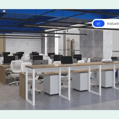 Modern open-plan office with rows of desks, white chairs, and desktop computers under a blue ceiling.