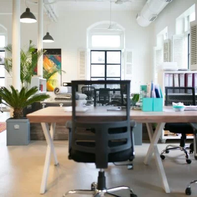 Office space full of desks.