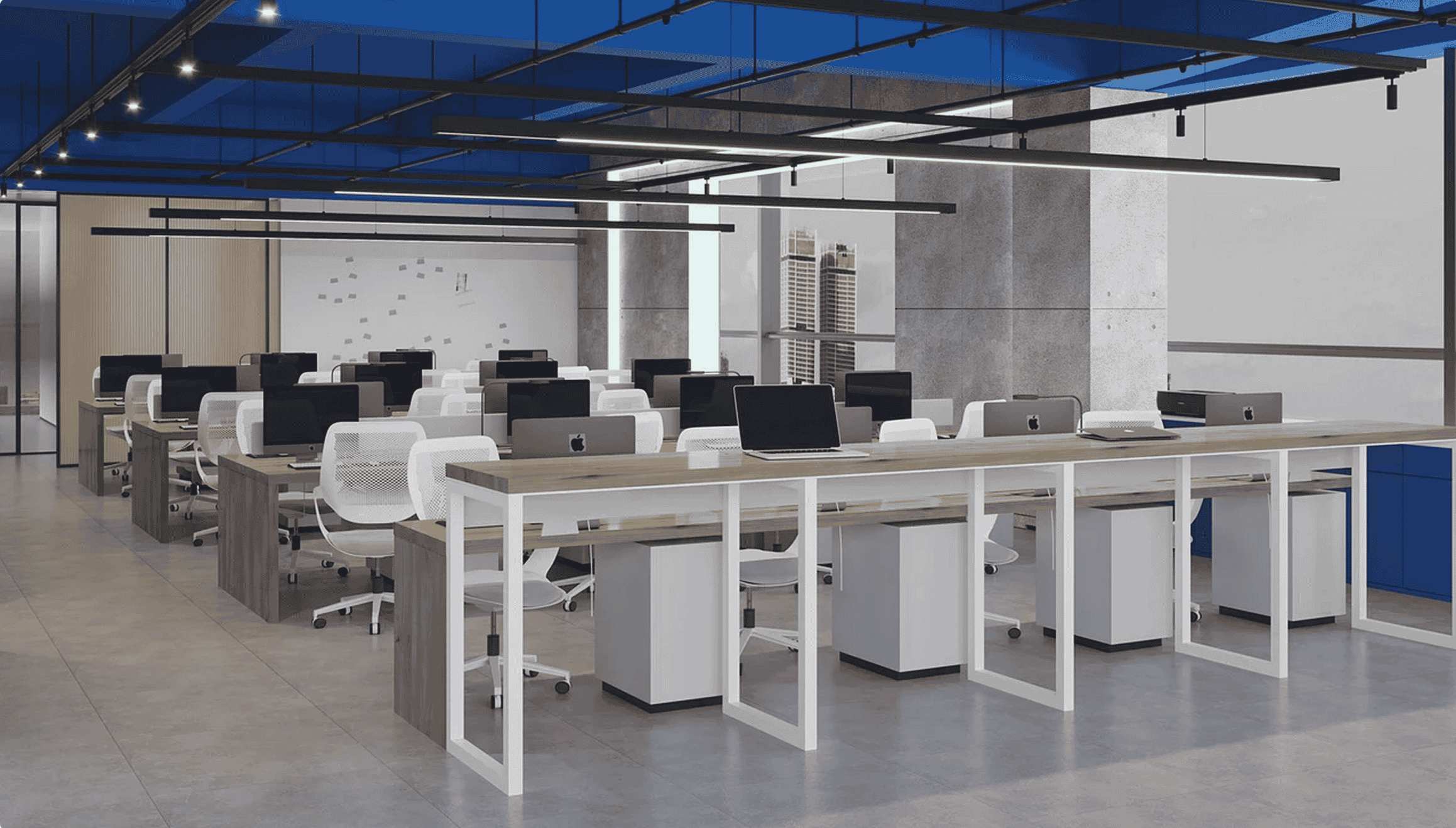 Modern open-plan office with rows of desks, white chairs, and desktop computers under a blue ceiling.