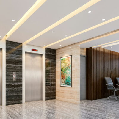 Modern lobby with two elevators, a small reception desk, artwork, and marble flooring.