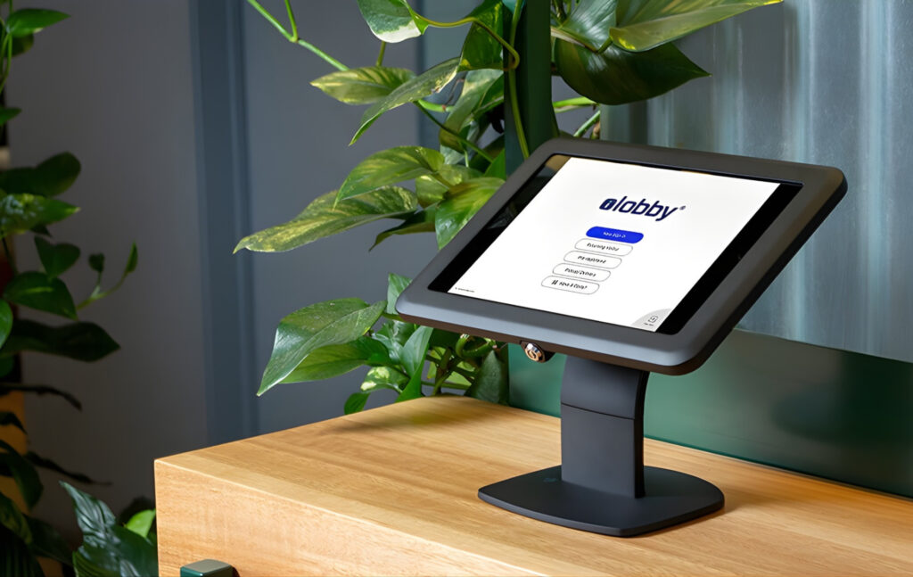 VisitorOS / iLobby visitor kiosk in use.