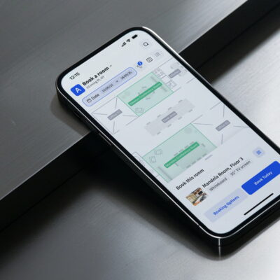Smartphone displaying Archie's meeting room booking app with floor plan and “Book Today” button on screen.
