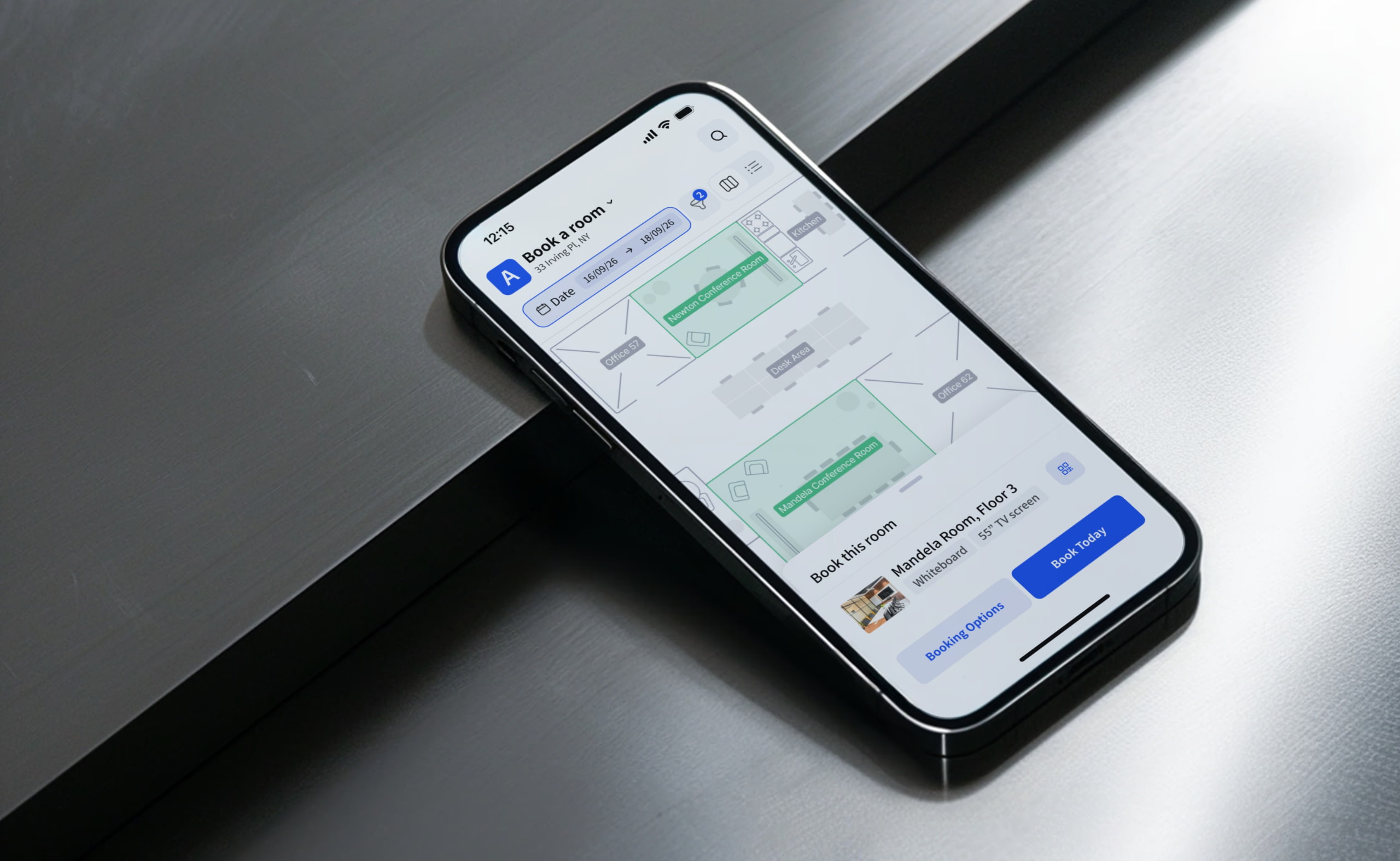 Smartphone displaying Archie's meeting room booking app with floor plan and “Book Today” button on screen.