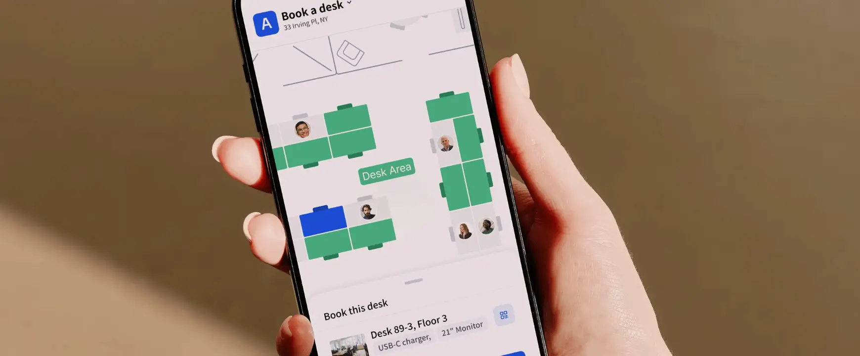 Close-up of Archie’s mobile desk booking app showing an interactive office floor plan and available workspaces on a smartphone.