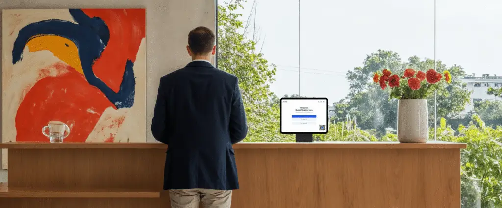 Visitor checking in using Archie’s self-service visitor management kiosk in a shared office building, enabling fast registration and automatic host notifications.